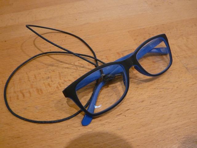 A pair of blue glasses found in registration area
